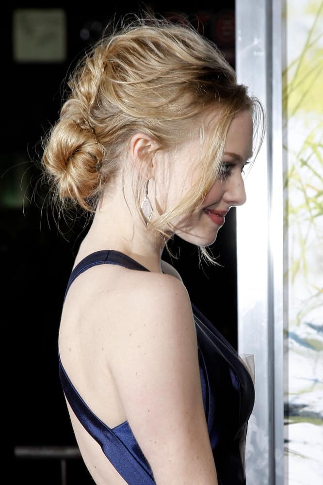 Amanda Seyfried wore a blue dress with her messy low bun hairstyle that has loose tendrils at the Dear John Premiere at Grauman's Chinese Theater, in Los Angeles, California on February 1, 2011.