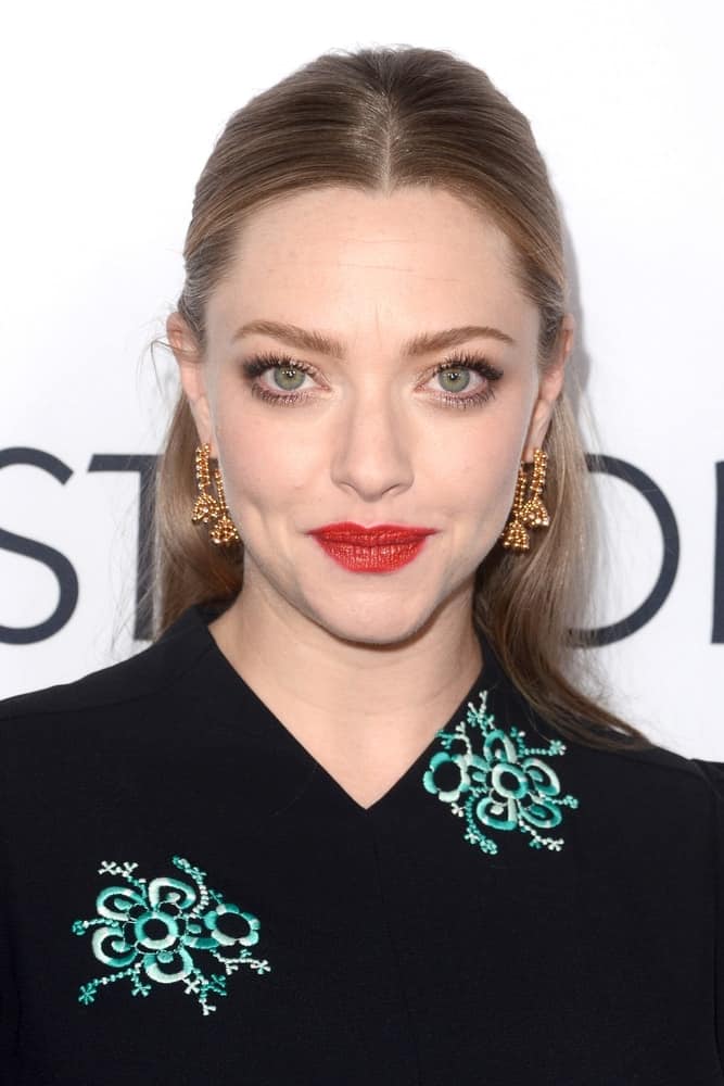Amanda Seyfried's floral outfit went perfectly well with her simple half-up hairstyle that has a slick and straight finish at the "The Last Word" Los Angeles Premiere at the ArcLight Theater on March 1, 2017 in Los Angeles, CA.