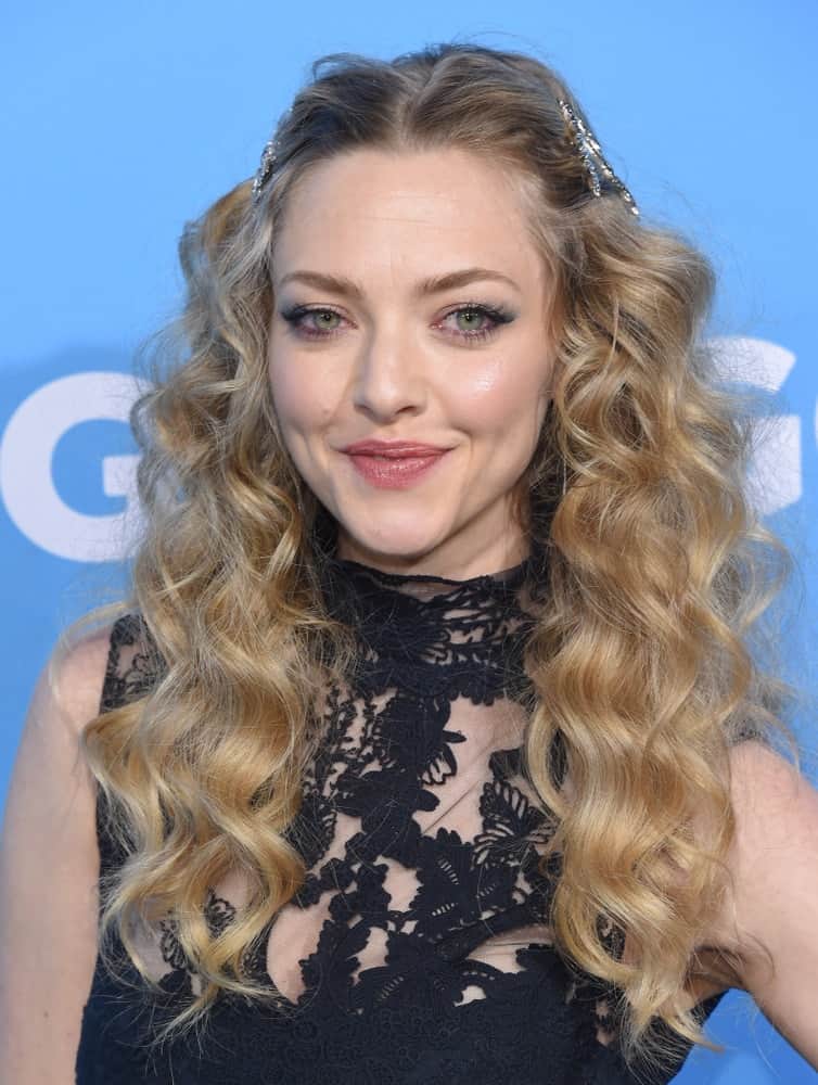Amanda Seyfried wore a simple black dress that complemented her pinned half-up hairstyle with sandy blond curls on her shoulders at the 'Gringo' World Premiere on March 6, 2018 in Los Angeles, CA.