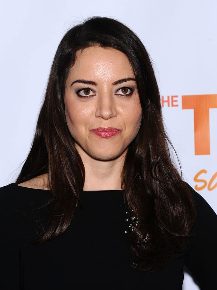 Aubrey Plaza was at the Trevor Project Honors Katy Perry on December 02, 2012 in Hollywood, CA. She paired her black dress with dark makeup and long raven hairstyle that is loose, tousled and layered.