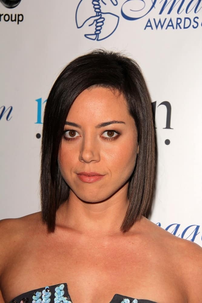 Aubrey Plaza was at the 28th Annual Imagen Awards at the Beverly Hilton Hotel on August 16, 2013 in Beverly Hills, CA. She paired her strapless dress with a silky straight raven bob hairstyle.