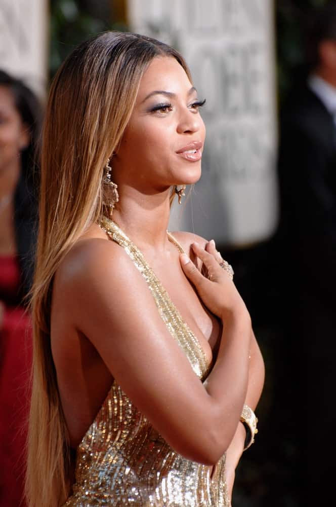 Beyonce matched her stunning gold gown with a long straight center-parted hairstyle at the 64th Annual Golden Globe Awards held at the Beverly Hilton Hotel on January 15, 2007.