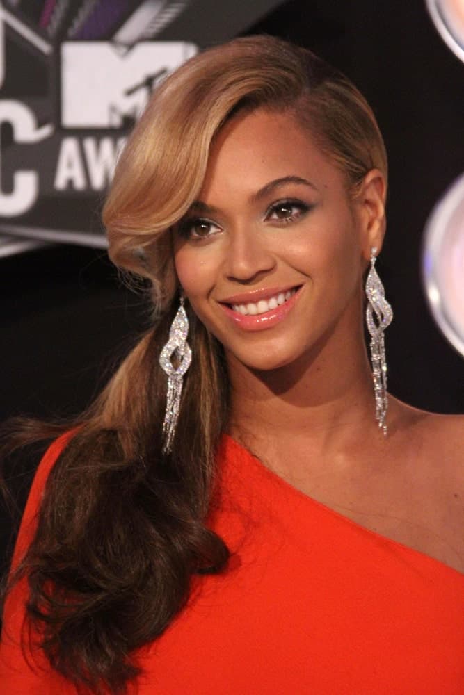 Beyonce Knowles gathered her thick wavy locks into a low ponytail with a deep side part during the 2011 MTV Video Music Awards Arrivals at Nokia Theatre LA Live, Los Angeles, CA last August 28, 2011.