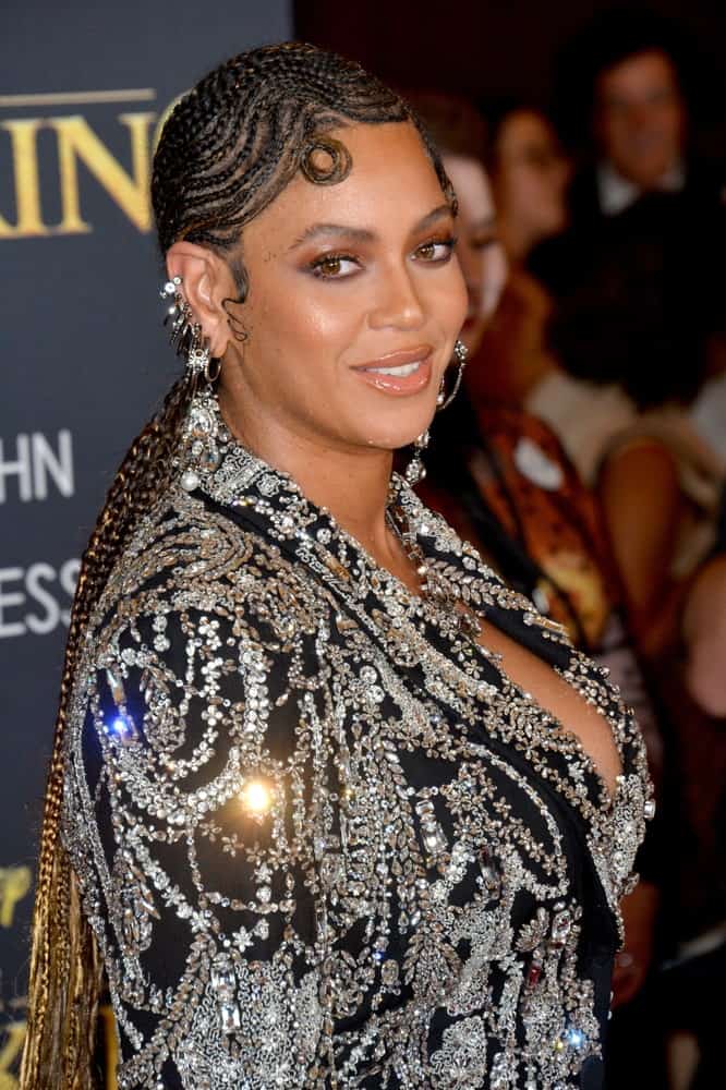 Beyonce Knowles shines in an embellished dress that perfectly goes with her swirling cornrows during the world premiere of Disney's "The Lion King" at the Dolby Theatre on July 10, 2019.