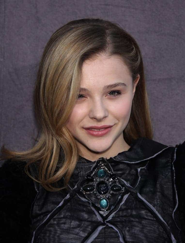 Chloe Grace Moretz was at the Critic's Choice Movie Awards 2012 on January 12, 2012, in Hollywood, CA. She wore a black dress that complemented her half-up brunette hairstyle with layers and side-swept bangs.