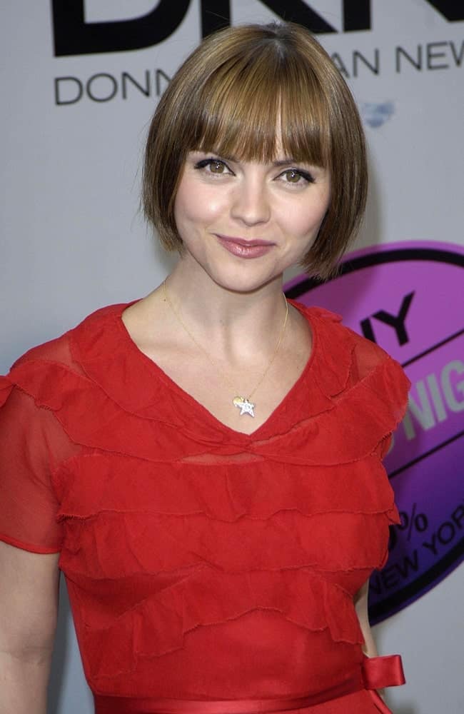 Christina Ricci attended the DKNY Delicious Night Fragrance Launch Party held at the 711 Greenwich Street, New York, NY on November 07, 2007. She paired her lovely red dress with a chic chin-length brunette bob hairstyle with blunt bangs.