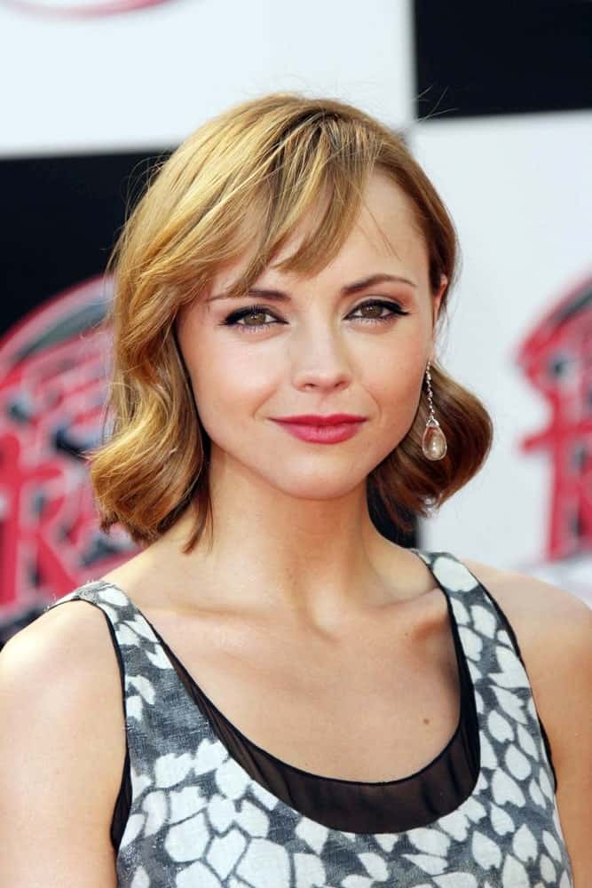 Christina Ricci was at the Premiere of "Speed Racer" held at the Nokia Theater in Los Angeles, California on April 26, 2008. She was seen wearing a lovely dress with her shoulder-length sandy blonde hairstyle that has large curls and side-swept bangs.