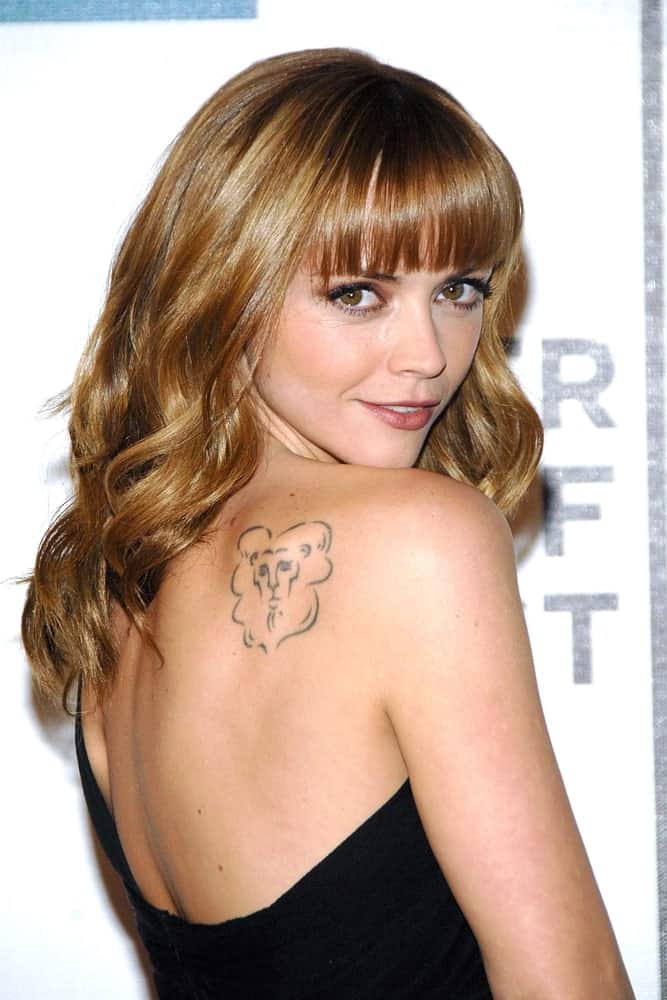 Christina Ricci attended the Speed Racer Premiere at the Closing Night of Tribeca Film Festival, Tribeca Performing Arts Center, BMCC TPAC in New York, NY on May 03, 2008. She wore a strapless black dress with her long and curly sandy blonde hairstyle with a slight tousle and blunt bangs.