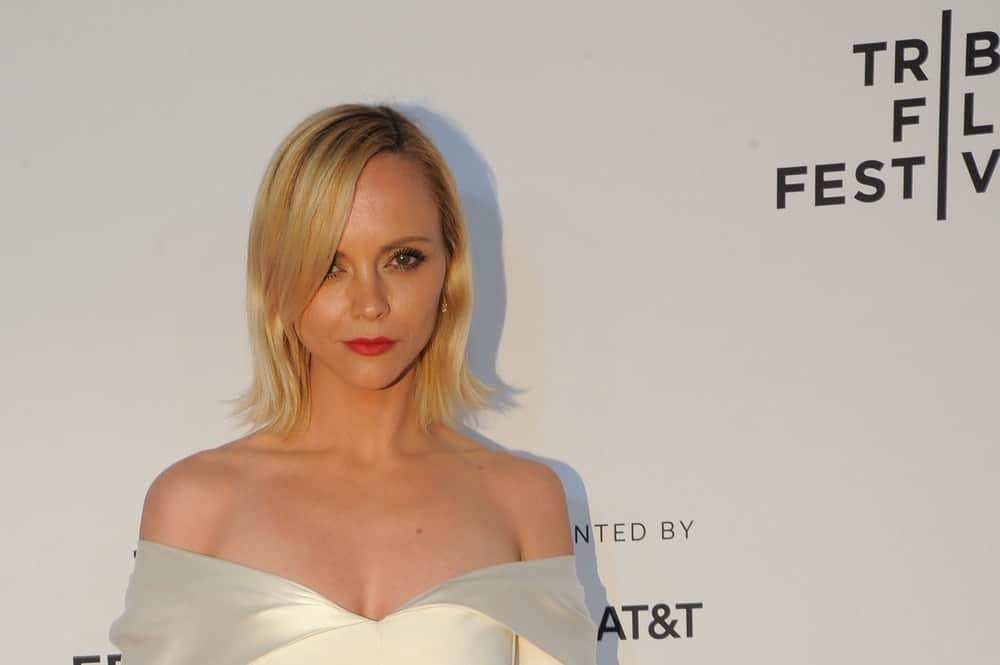 Christina Ricci attended the 'Clive Davis: The Soundtrack Of Our Lives' World Premiere at Radio City Music Hall on April 19, 2017 in New York City. She was stunning in her white dress that she paired with shoulder-length straight blonde hairstyle that has highlights and side-swept bangs.