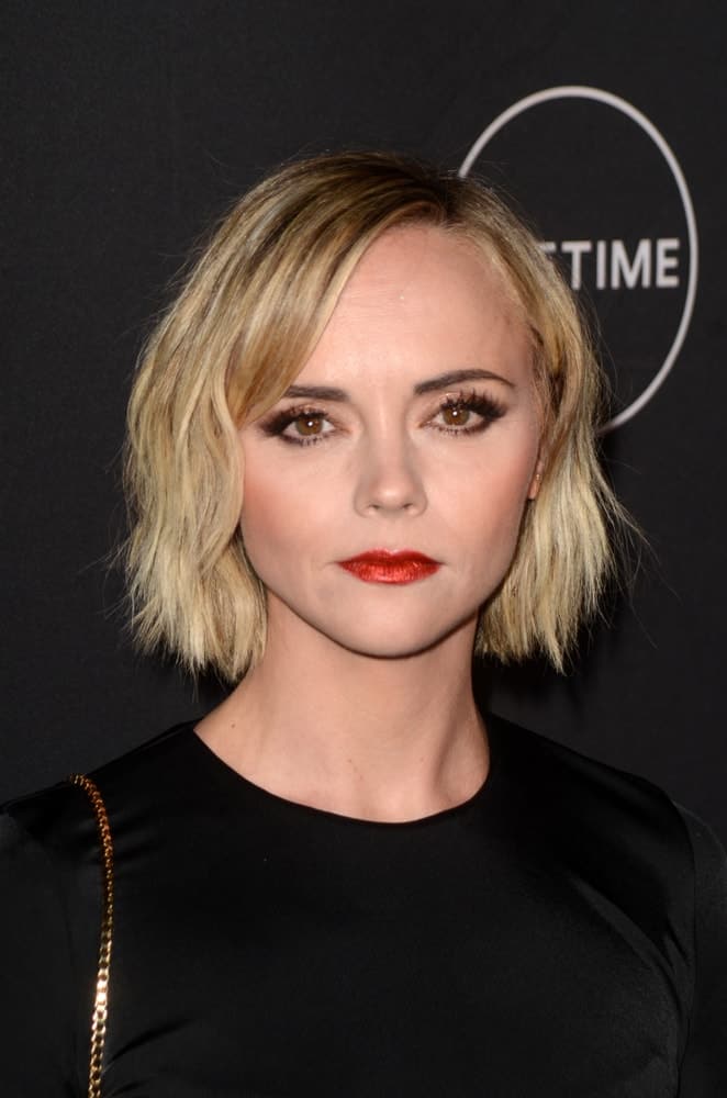 Christina Ricci was at the Lifetime Winter Movies Mixer at The Andaz on January 9, 2019 in West Hollywood, CA. She paired her black outfit with a tousled and highlighted chin-length blonde hairstyle.