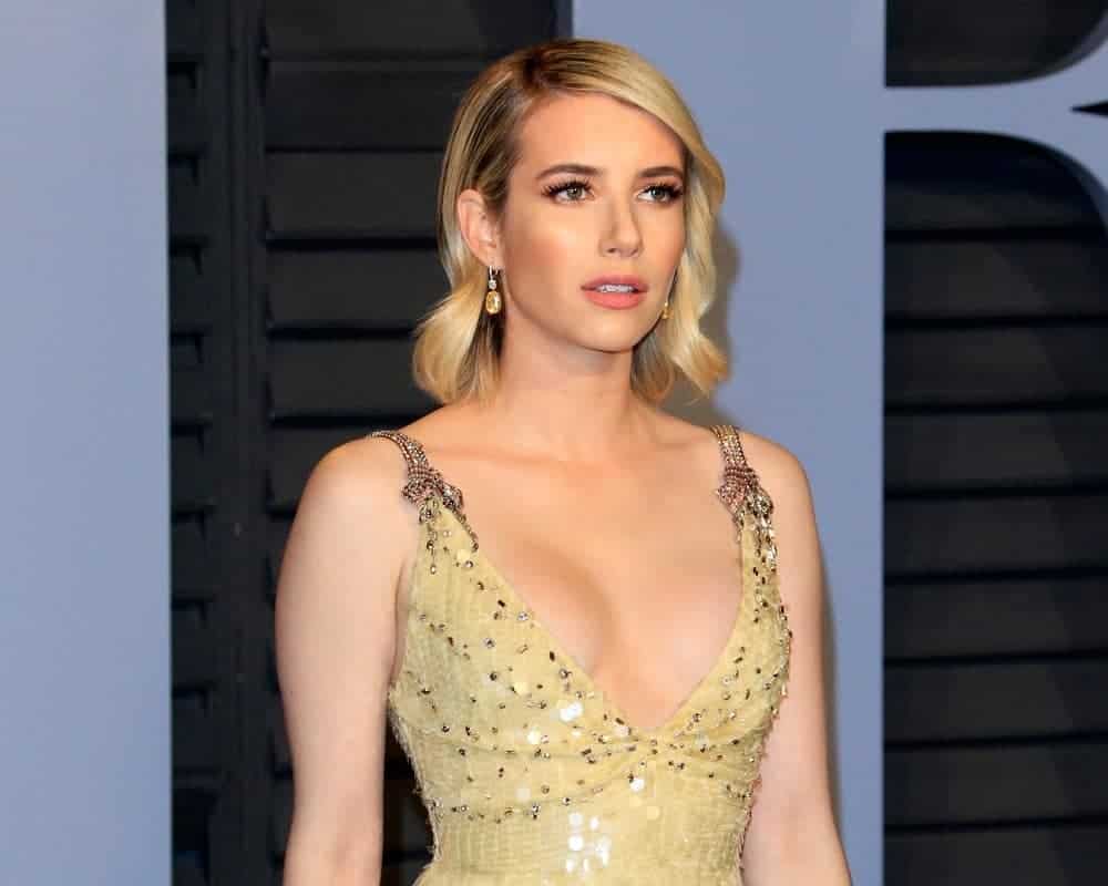 Emma Roberts was at the 24th Vanity Fair Oscar After-Party at the Wallis Annenberg Center for the Performing Arts on March 4, 2018, in Beverly Hills, CA. She was stunning in a golden dress that she topped with a shoulder-length tousled sandy-blonde hairstyle with waves and side-swept bangs.