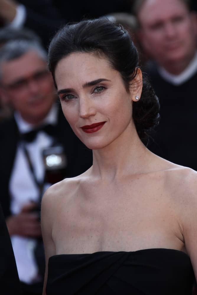 Jennifer Connelly attended the 'Once Upon A Time' Premiere during 65th Annual Cannes Film Festival during at Palais des Festivals on May 18, 2012 in Cannes, France. She paired her black strapless dress with an elegant low bun raven hairstyle with a neat finish.