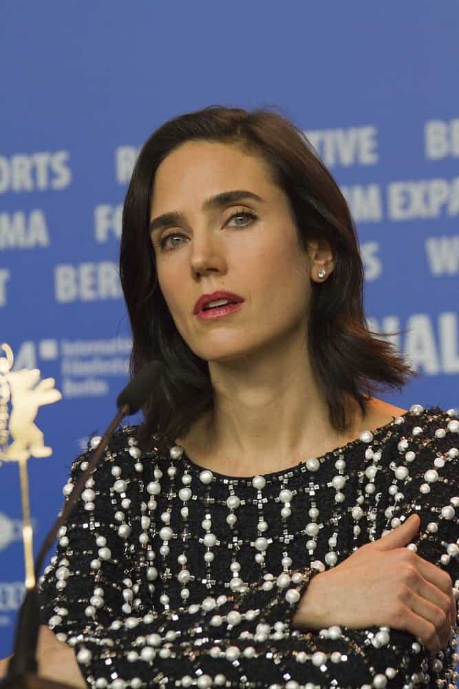 Jennifer Connelly attended the 'Aloft' press conference during the 64th Berlinale Film Festival at Grand Hyatt Hotel on February 12, 2014 in Berlin, Germany. She wore a dress with pearls to pair with her shoulder-length tousled raven hairstyle with layers.