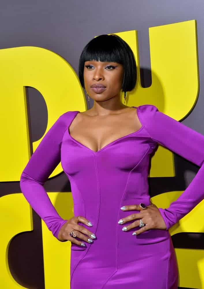 On April 06, 2017, actress/singer Jennifer Hudson attended the premiere for "Sandy Wexler" at The Cinerama Dome, Hollywood. She was stunning in a purple dress that she paired with a chin-length raven hairstyle with blunt bangs.