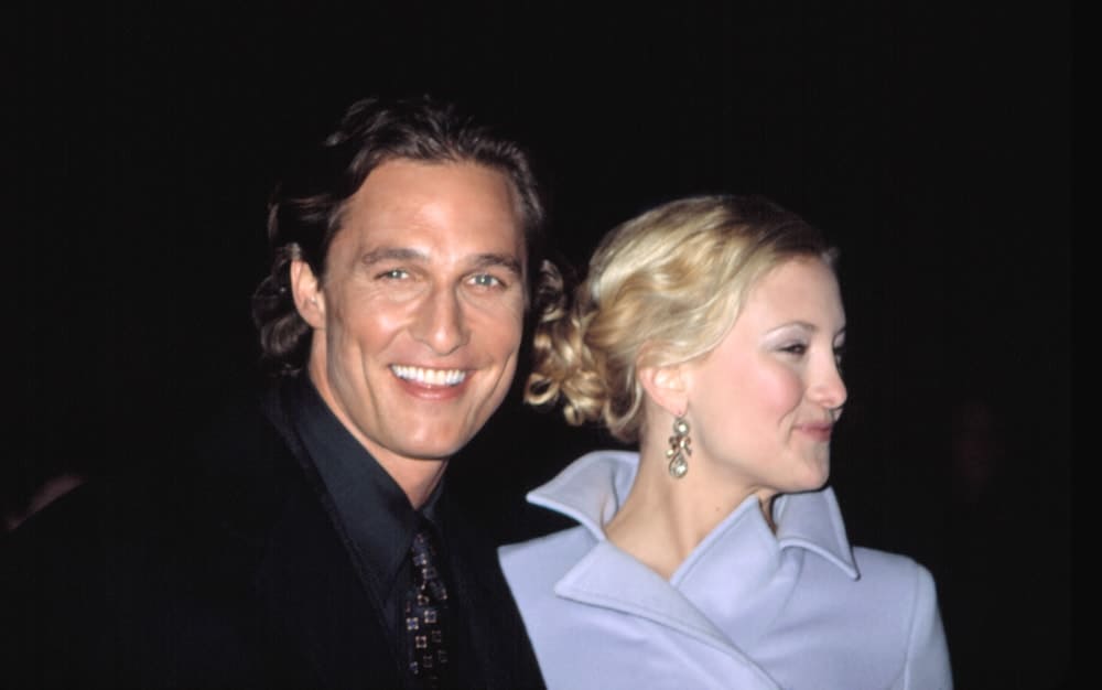 Kate Hudson and Matthew McConaughey were at the premiere of HOW TO LOSE A GUY IN 10 DAYS in New York on February 2, 2003. Hudson wore a lovely blue winter jacket with her blond hair swept up into a messy and curly bun hairstyle with loose tendrils.