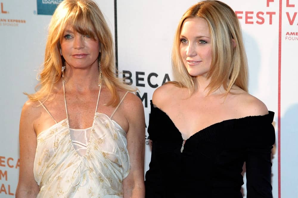 Kate Hudson and her mother attended the screening of RAISING HELEN at the Tribeca Performing Arts Center for the 2004 Tribeca Film Festival on May 1, 2004 in New York City. Hudson wore a stunning black velvet dress that she paired with a long and straight hairstyle with layers.