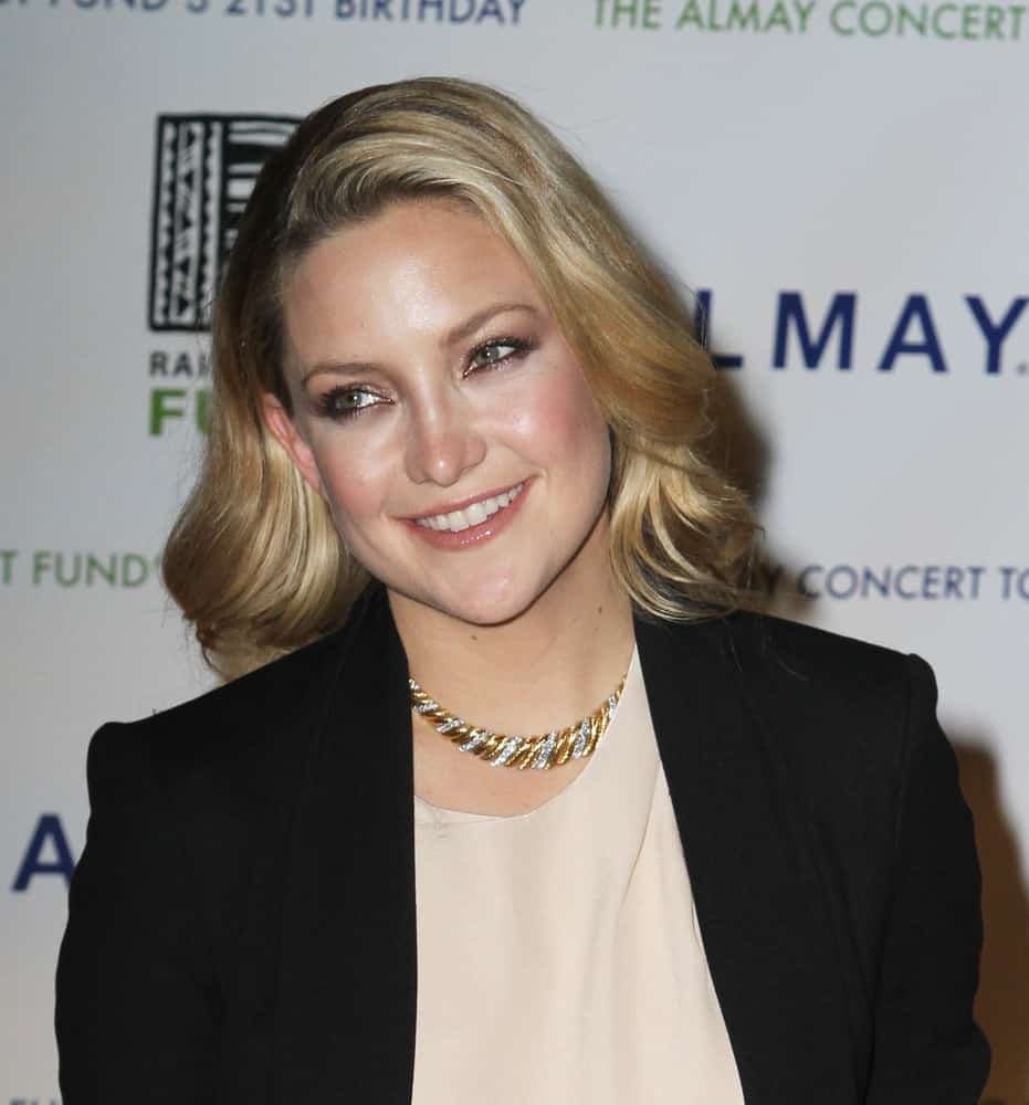 Actress Kate Hudson attended the Almay Concert to celebrate the Rainforest Fund's 21st birthday at the Plaza Hotel on May 13, 2010 in New York City. She wore a simple smart casual outfit that she paired with a shoulder-length sandy blond hairstyle that has elegant curls.