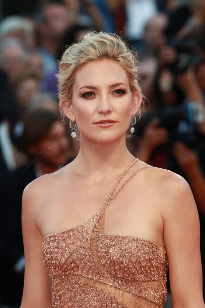 Kate Hudson was quite stunning in her fashionable blush-colored sequined dress and messy bun hairstyle with highlights and loose tendrils at the Venice Film Festival on August 30, 2012 in Venice, Italy.