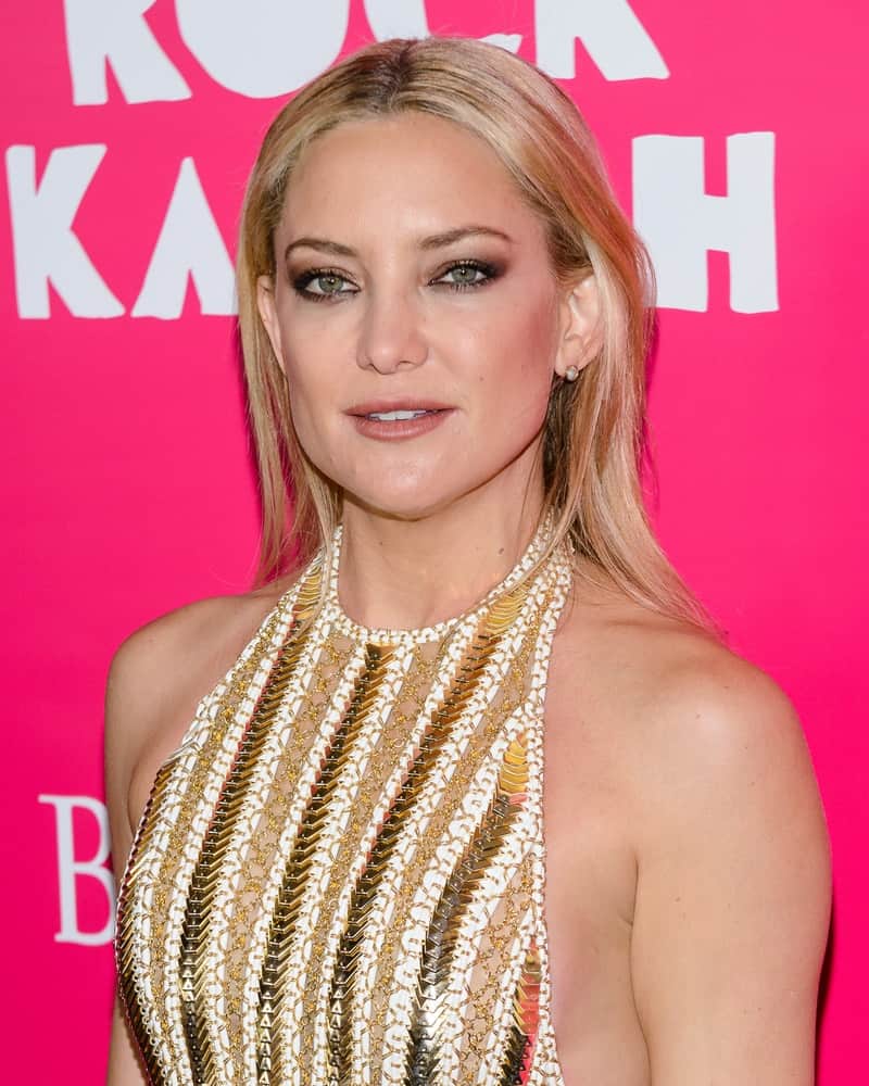 Kate Hudson wore a fashion-forward outfit that flaunted her physique and straight sandy blond hairstyle tucked behind her ears when she arrived at the red carpet premiere of "Rock The Kasbah" in New York, NY on October 19th 2015.