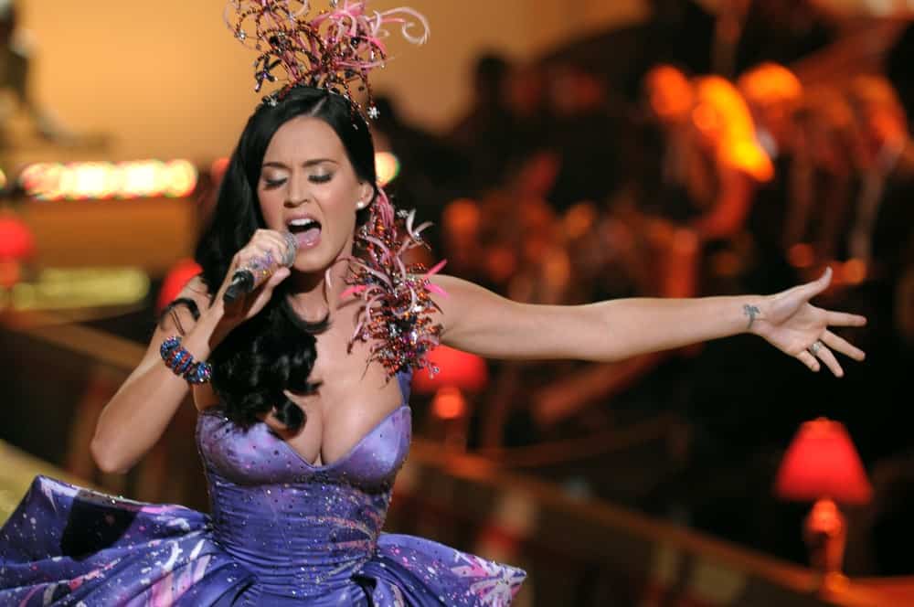 Singer Katy Perry walked the runway during the 2010 Victoria's Secret Fashion Show on November 10, 2010 with her long wavy hair accented with a statement headdress.