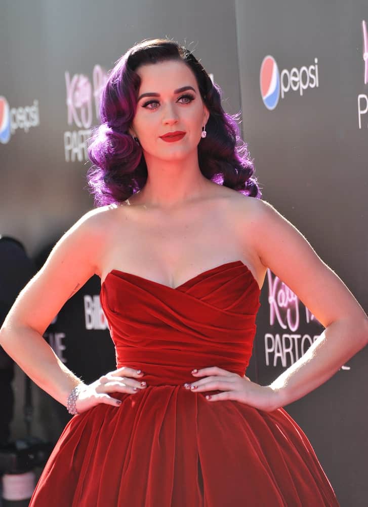 Katy Perry displayed a bold look with her red dress and purple curls during the premiere of her new movie "Katy Perry: Part of Me" at Grauman's Chinese Theatre, Hollywood on June 27, 2012.