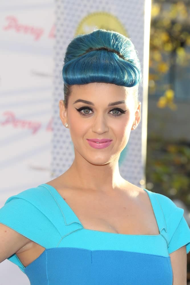 Katy Perry matched her blue outfit with a sleek updo featuring her bumper bangs during the Launch of "Katy Perry Lashes" at The Americana at Brand on February 22, 2012.