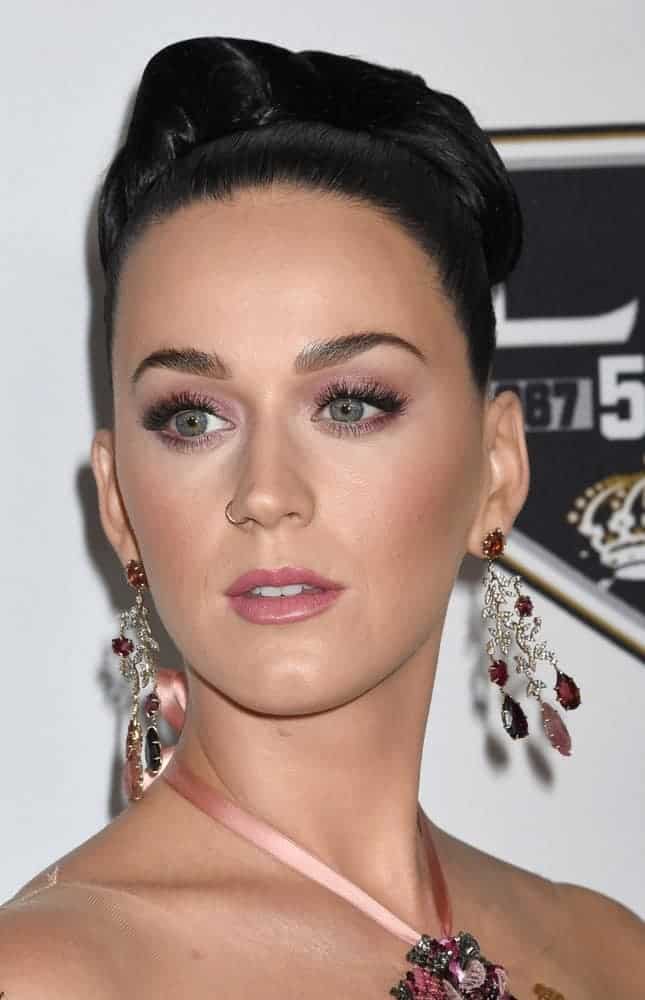 Katy Perry is a golden Goddess in a glittering Champagne off-the-shoulder floral beaded gown and her brunette hair was gathered into an elaborate updo with extravagant earrings to satisfy the audiences at the CHLA Once Upon A Time Gala.