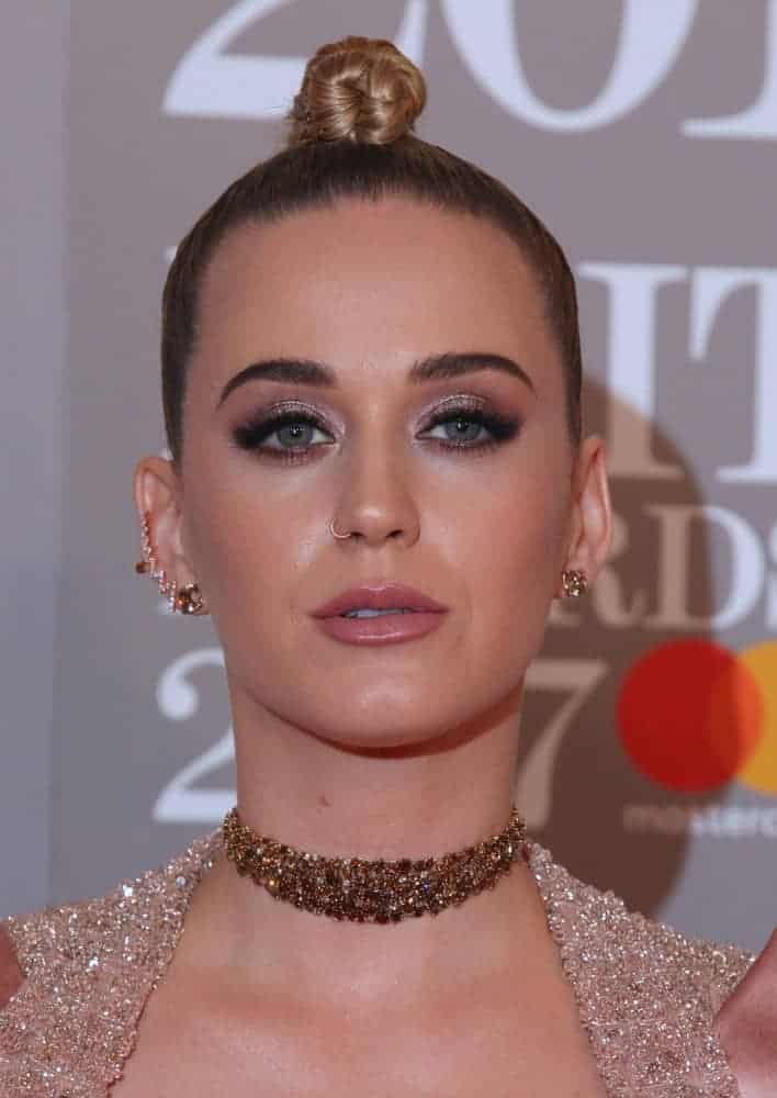 Katy Perry experiments with her blonde locks and styled it with a daring faux-hawk. She oozed glamour in this embellished mini dress with a matching blazer that's certainly made an impression during the 2017 BRIT Awards.