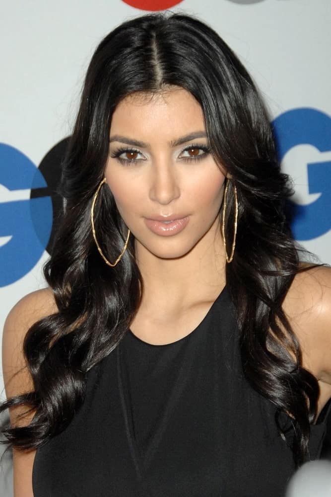 Kim Kardashian with her center-parted waves paired with big hoop earrings at The 13th Annual GQ 'MEN OF THE YEAR' Party, Chateau Marmont Hotel, Los Angeles, CA on November 18, 2008.