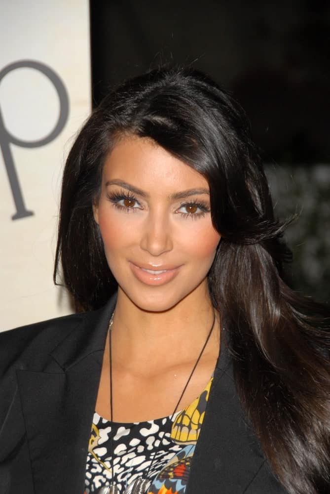 Kim Kardashian at the "Open Campus" New OP Campaign Launch Party on July 7, 2009, with her loose jet black hair complemented with a natural-looking make-up.