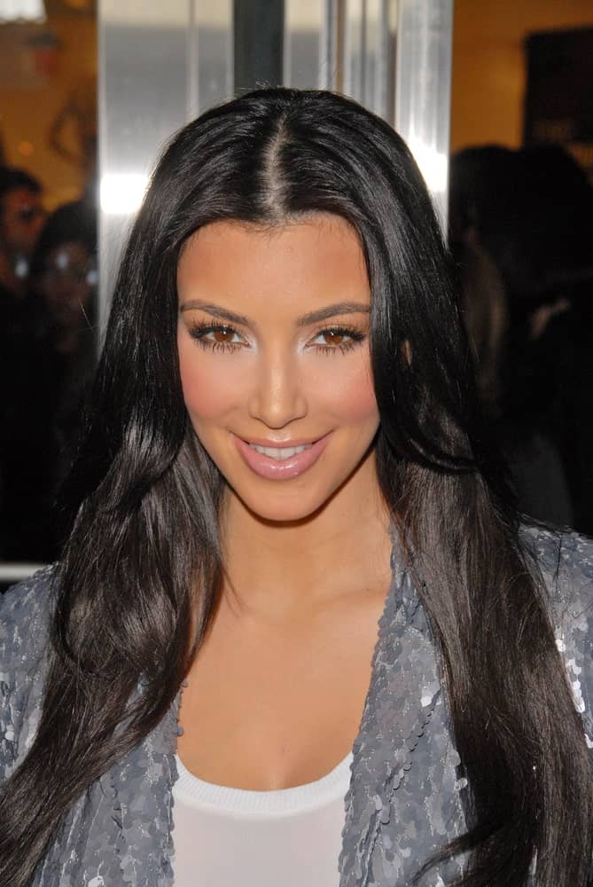 Kim Kardashian at the Launch Event for FusionBeauty's Infatuation Lip Gloss on October 15, 2009 showing off her simple loose waves with a middle parting.