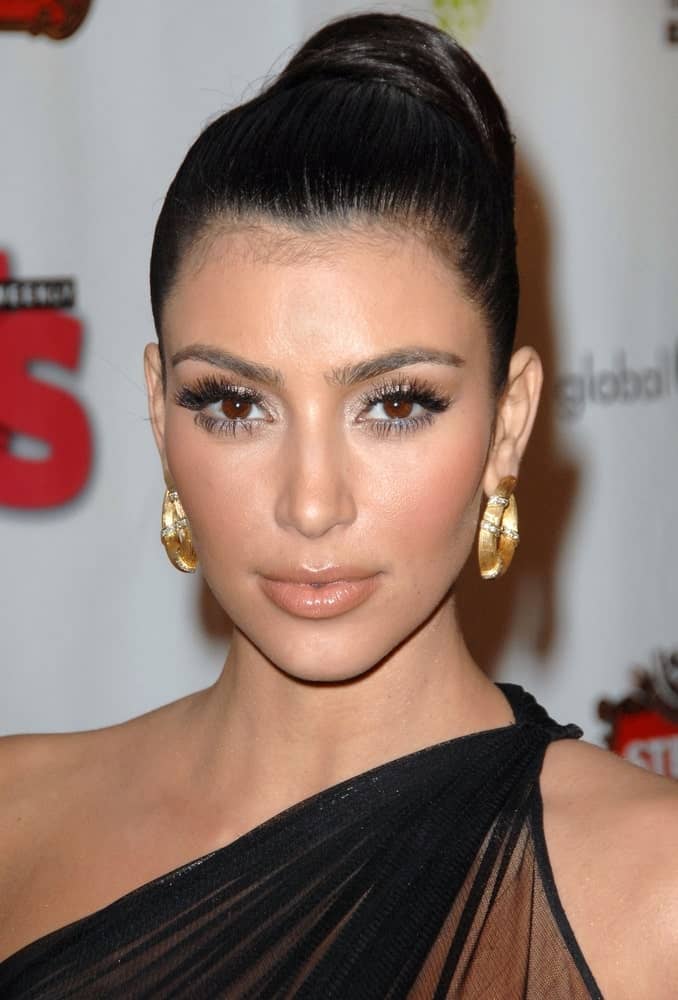 On February 8, 2009, Kim Kardashian was seen at Russell Simmons Salute to Grammy Award Nominees' celebration After Party with her jet black hair arranged into a slicked high bun.