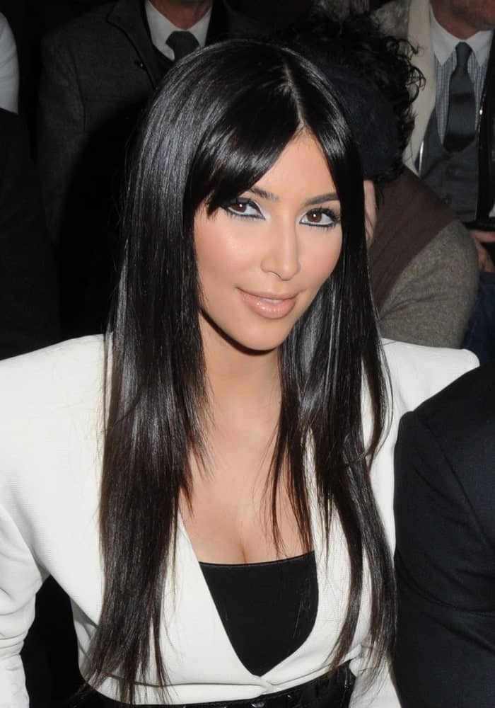 Kim Kardashian was spotted at the Y-3 Fall 2009 Collection Fashion Show on February 15, 2009, wearing a contrasting black and white outfit along with her long layered locks incorporated with curtain bangs.