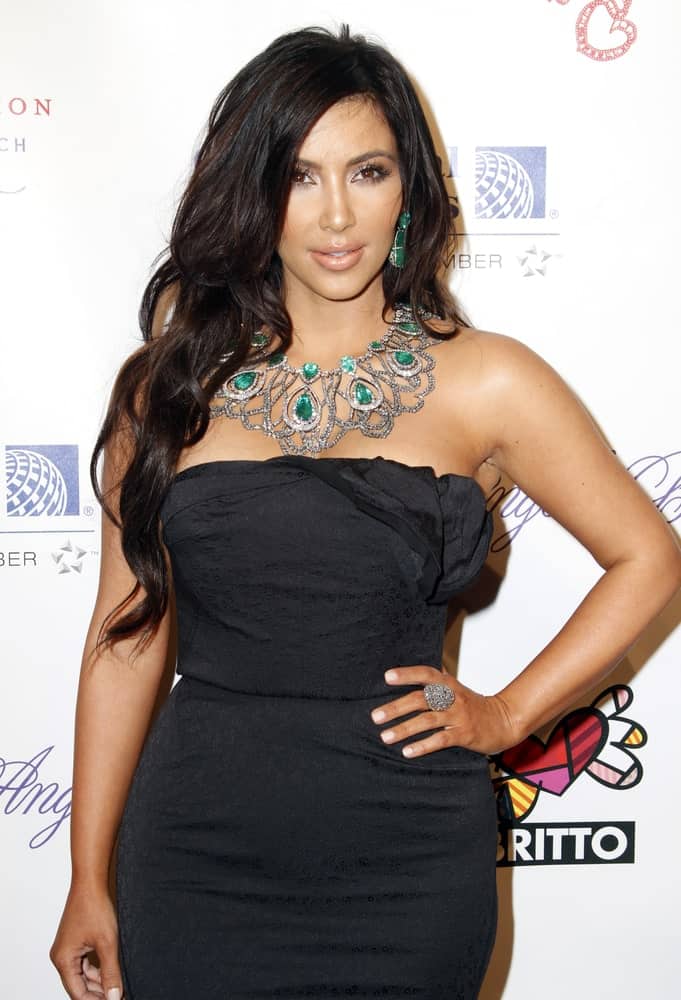 Kim Kardashian with her side-parted waves as she attends the Angel Ball 2010 hosted by Gabrielle's Angel Foundation for Cancer Research at Cipriani's on October 21, 2010.