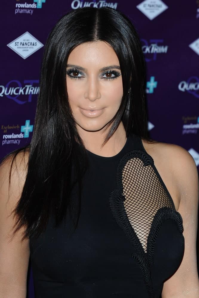 On May 18, 2012, Kim Kardashian attended the Quick Trim launch event at the Renaissance St.Pancras, London showing off her shiny black straight locks with middle parting.