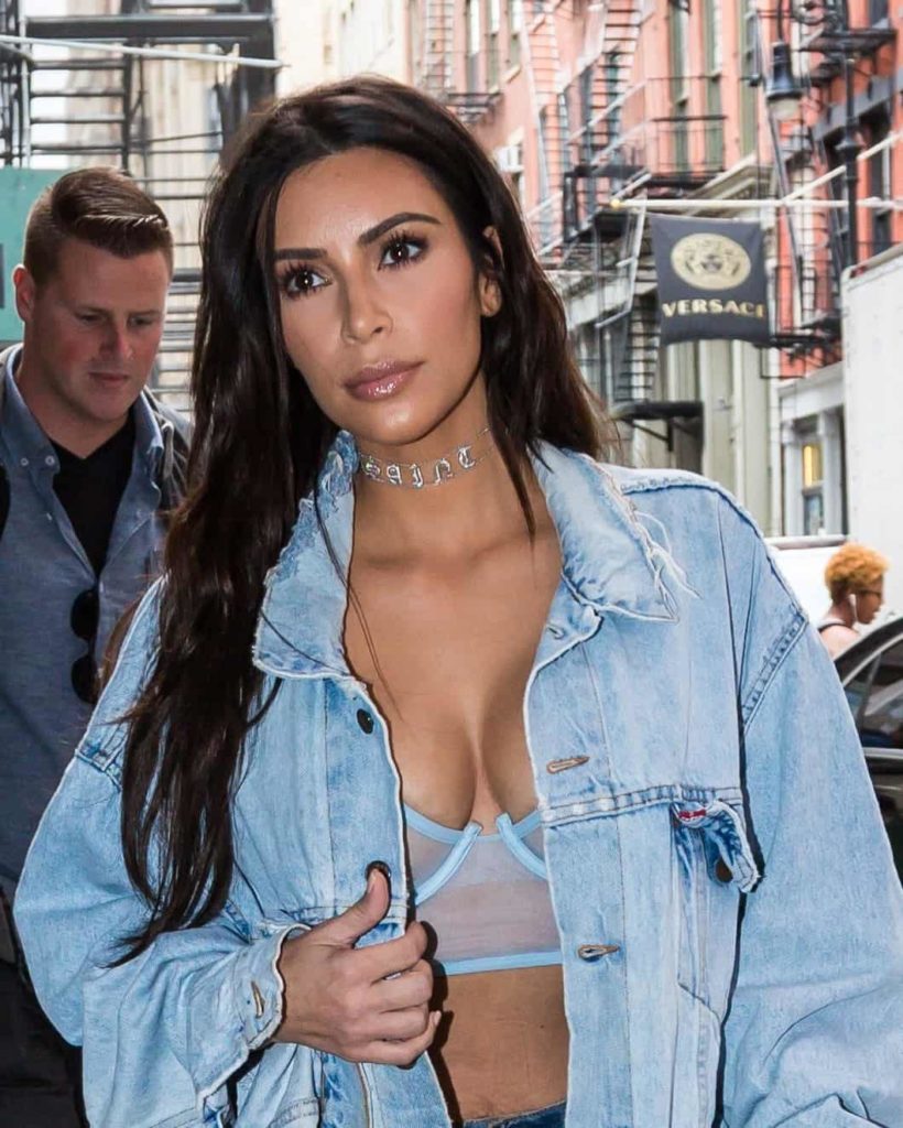 Kim Kardashian turned street style in a sexy denim attire with her loose messy hairstyle as she exits her hotel in NYC.