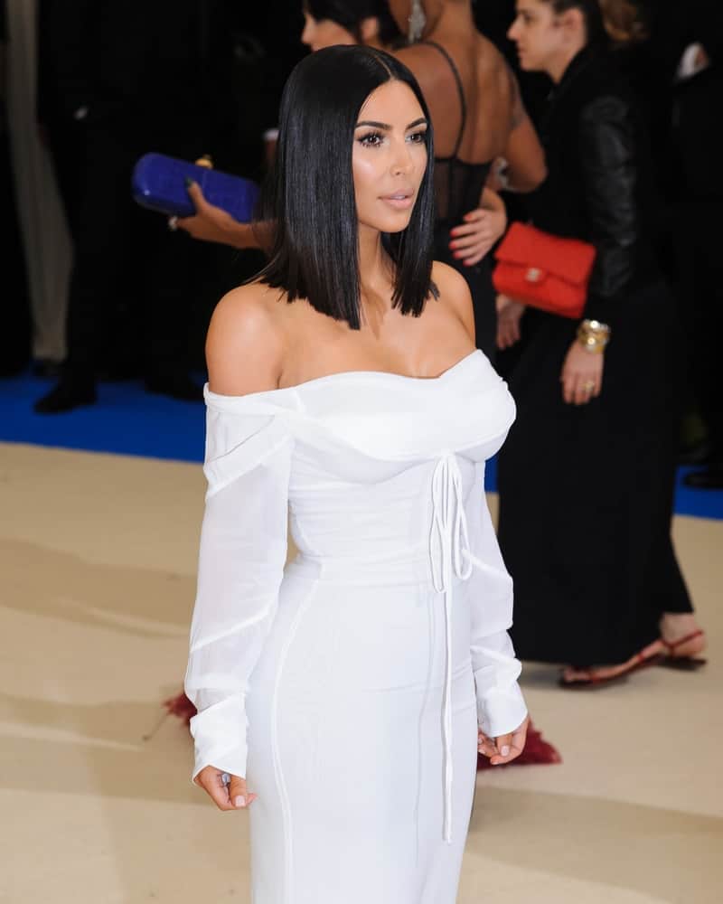 Kim Kardashian chose an elegant white off-shoulder gown and topped it off with super sleek shoulder-length center-parted hairstyle during the 2017 Metropolitan Museum of Art Costume Institute Benefit Gala.