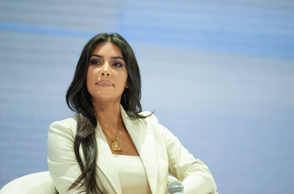 On October 8, 2019, Kim Kardashian gave a speech in Armenia during the WCIT forum in a smart white suit along with her long wavy hair with a middle parting.