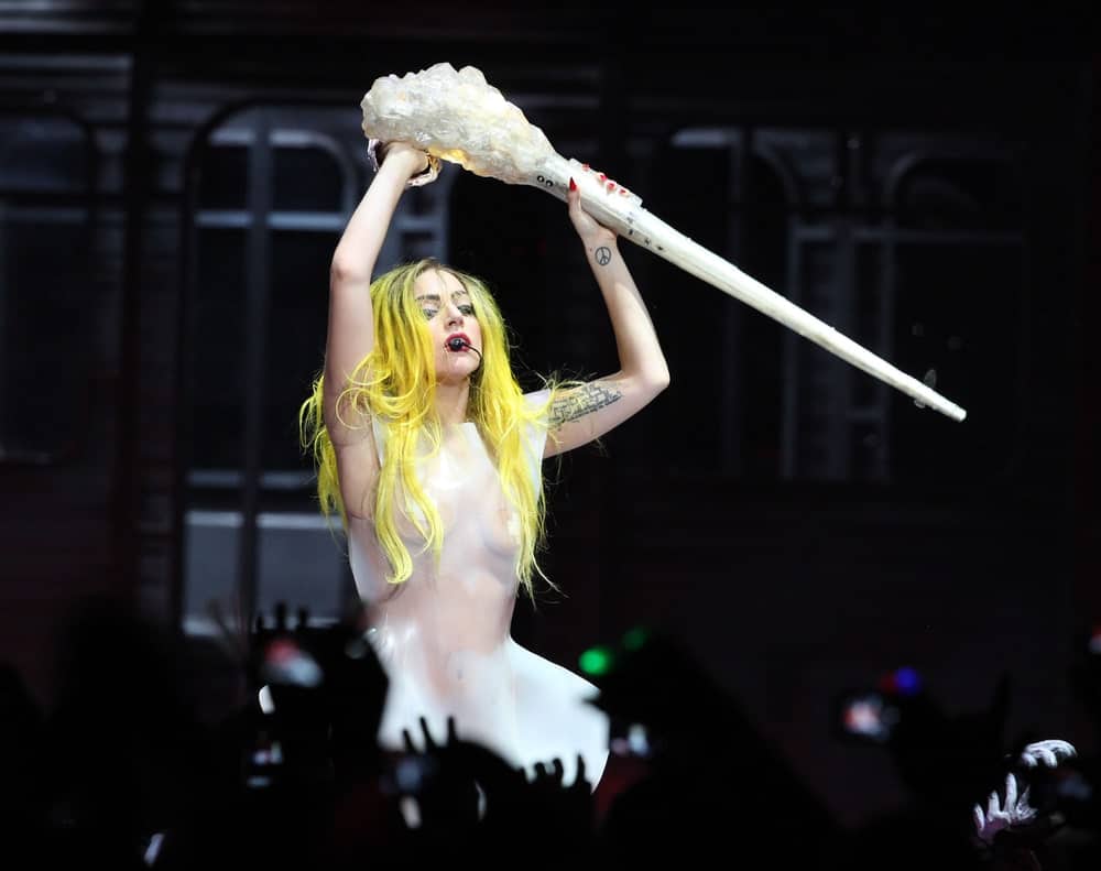 Lady Gaga performed at Staples Center on March 28, 2011 in Hollywood, CA. She looked like a mannequin in her white see-through latex outfit that makes her long, center-parted dyed yellow hair stand out.