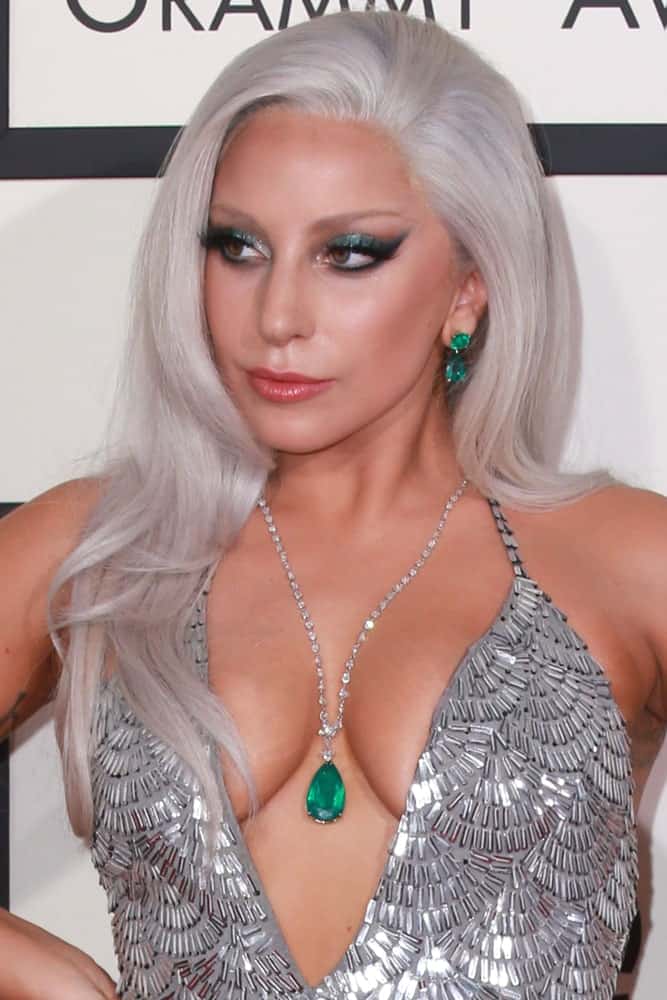 Lady Gaga brought a little bit of the Broadway spirit with her at the 57th Annual GRAMMY Awards at the Staples Center on February 8, 2015. She wore a lovely silver dress that paired quite nicely with her silvery gray long side-swept hairstyle.