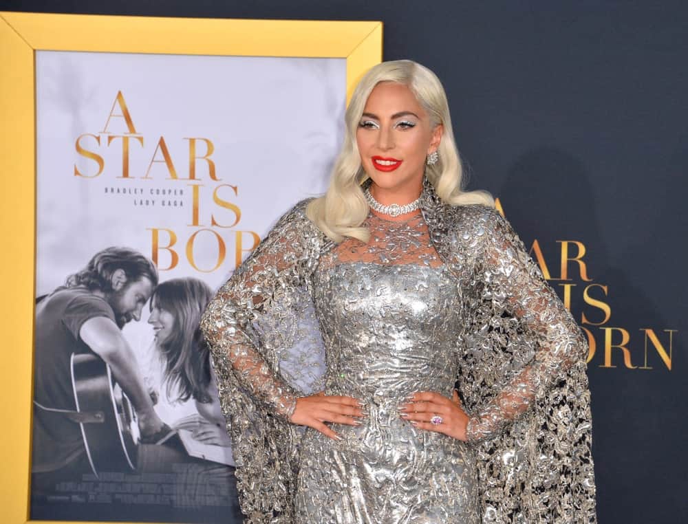 On September 24, 2018, Lady Gaga was at the Los Angeles premiere for "A Star Is Born" at the Shrine Auditorium. She wore a beautiful silver detailed gown that went well with her white blond hair with loose vintage waves.