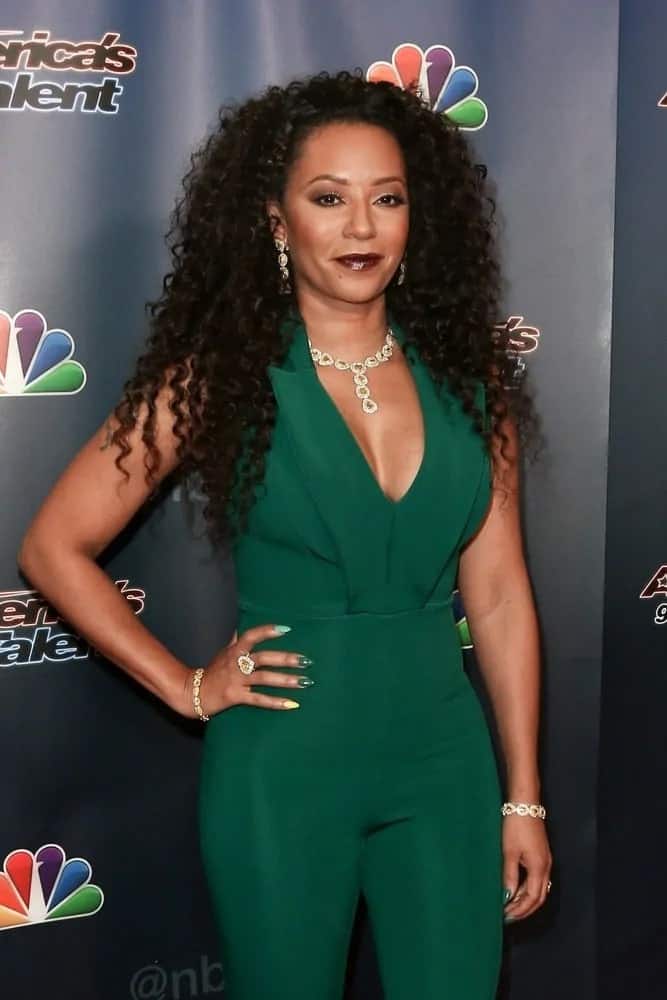 Mel B looks sensational in a teal jumpsuit as she wears her naturally kinky strands loose, completely complementing her red carpet looks at the America's Got Talent Season 10 Semi-finals taping on September 9, 2015.