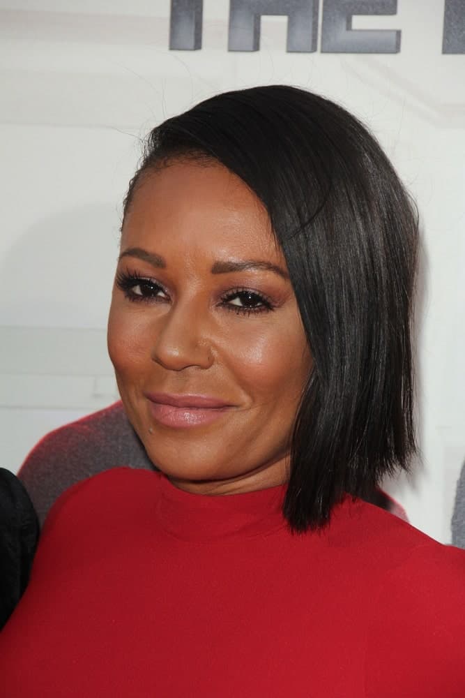 Mel B was spotted at the Barbershop - The Next Cut Premiere on April 6, 2016, wearing a red dress and black bob with a deep side parting.