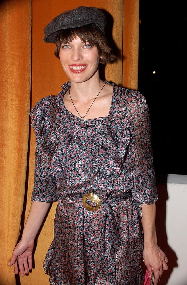 Milla Jovovich was at The Weinstein Company Golden Globe Party held at the Trader Vic's Restaurant at The Beverly Hilton Hotel, Los Angeles, CA on January 16, 2006. She was wearing a colorful dress to pair with her dark brunette pixie hairstyle incorporated with a hat.