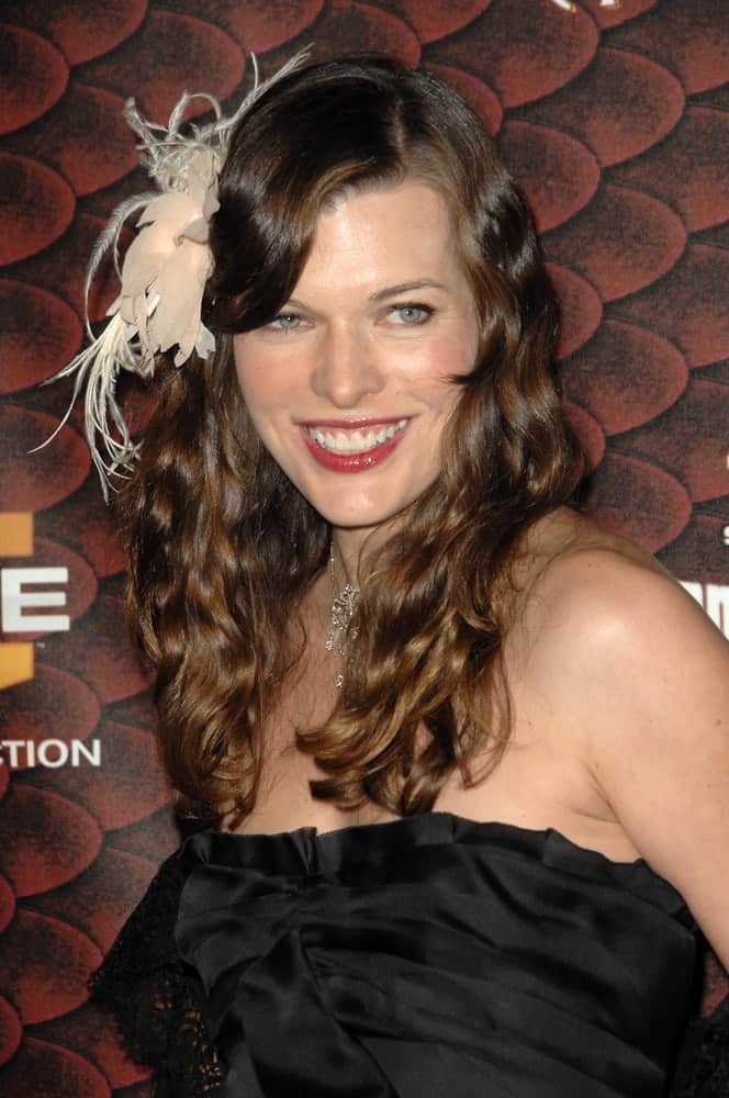 Milla Jovovich attended the Spike Tv's 'Scream 2008' held at the Greek Theatre in Hollywood, CA on October 18, 2008. She came wearing a black strapless dress with her long and curly brunette hairstyle incorporated with a ribon and side-swept bangs.