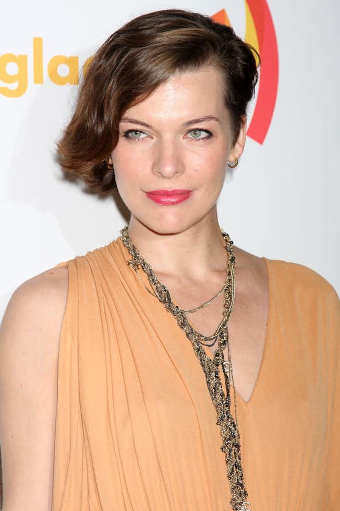 Milla Jovovich was at the 23rd GLAAD Media Awards at Westin Bonaventure Hotel on April 21, 2012 in Los Angeles, CA. She was charming in her simple beige dress, red lips and chin-length brunette hairstyle that is side-swept.