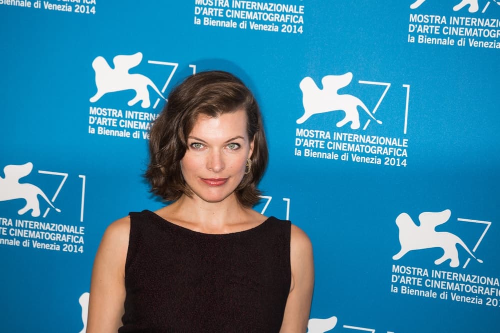 Milla Jovovich attended the 'Cymbeline' Photocall during the 71st Venice Film Festival on September 3, 2014 in Venice, Italy. She was lovely in her dark dress and side-swept wavy chin-length brunette hairstyle.