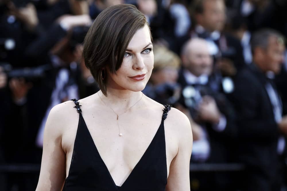 On MAY 20, 2020, Milla Jovovich attended the 'The Last Face' Premiere during the 69th Cannes Film Festival on May 20, 2016 in Cannes, France. She was stunning in a black dress and a chin-length raven hairstyle with long side-swept bangs.