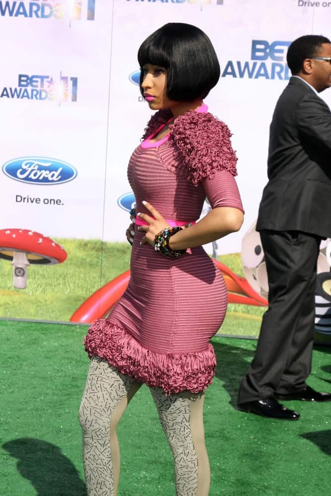 Nicki Minaj wore a pair of gray leggings with her purple striped dress and chin-length raven hairstyle with blunt bangs at the 11th Annual BET Awards at Shrine Auditorium on June 26, 2011 in Los Angeles, CA.