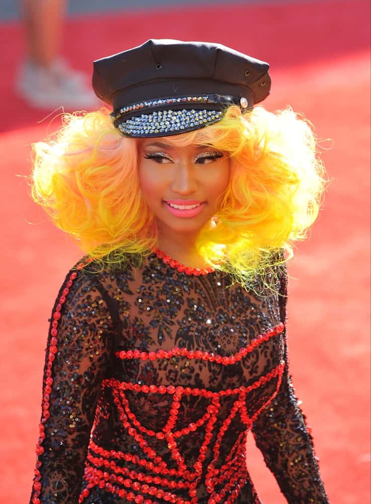 On September 6, 2012, Nicky Minaj was at the 2012 MTV Video Music Awards at Staples Center, Los Angeles. She wore an artistic red and black body suit that she paired with a tousled and curly yellow-dyed shoulder-length hairstyle.